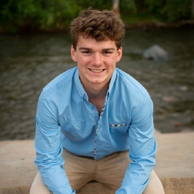 Jack, principal consultant at Headwaters Cyber, in an outdoor working environment
